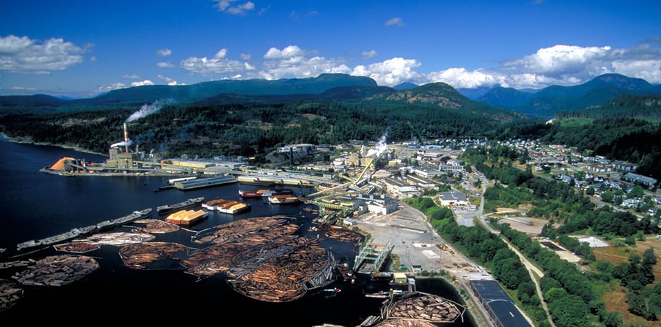 Aerial view of a coastal British Columbia pulp-and-paper mill on the water